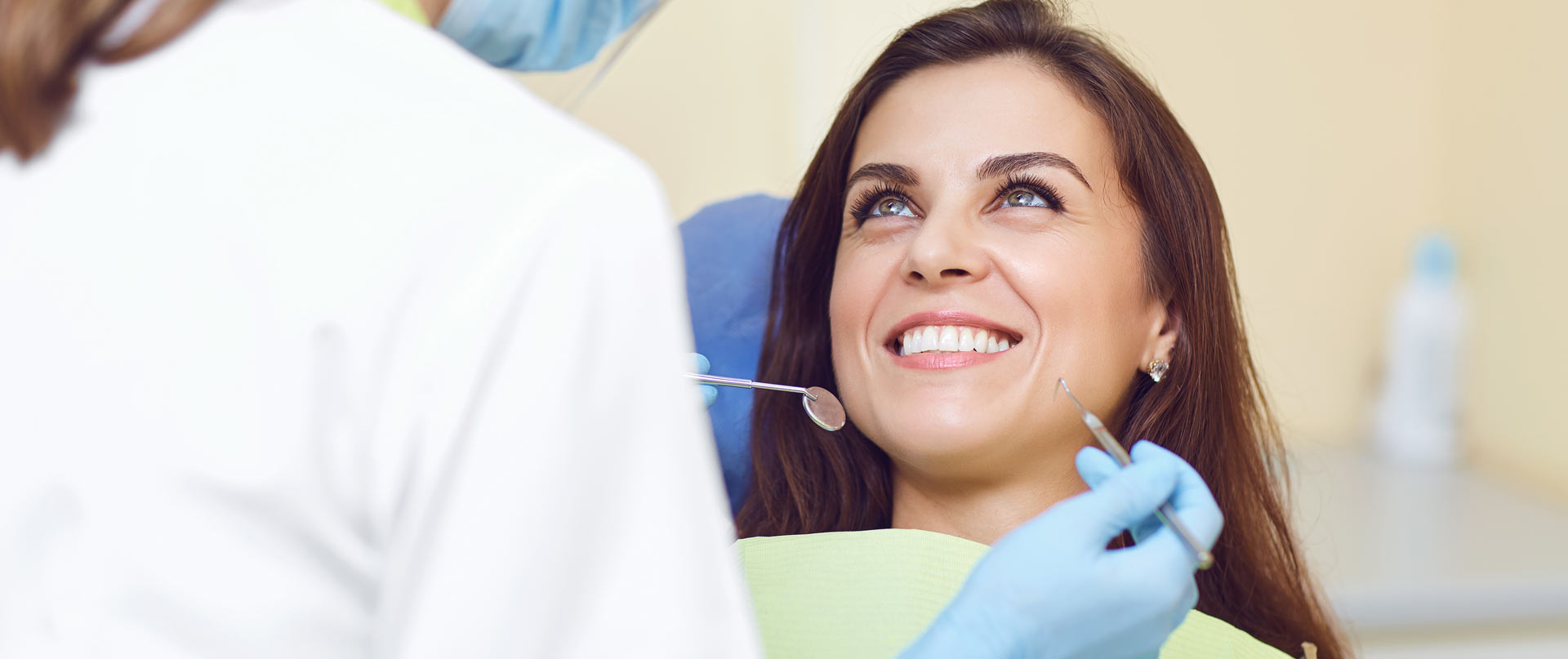 woman smiles at the denist | Klamath Smiles Dental Clinic